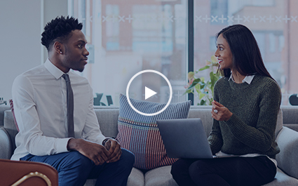 Two people talking on couch