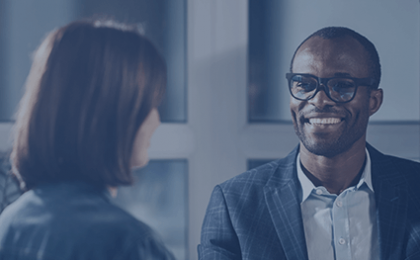 man smiling at woman